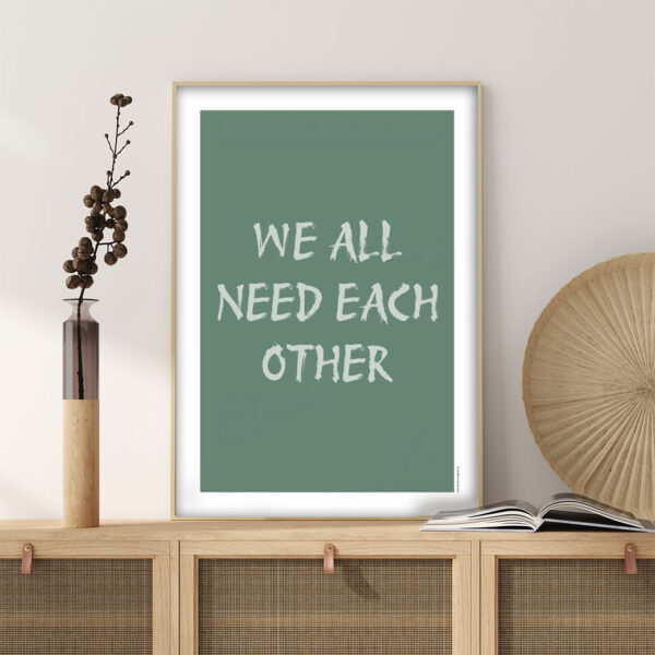 viser citatplakaten med citatet "We all need each other" på mintgrøn baggrund fra www.plakatcompagniet.dk